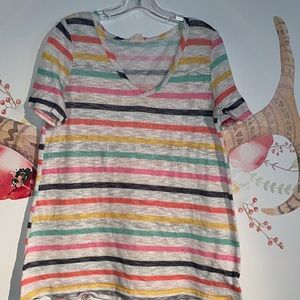 Multi colored shirt. See through so might want to wear a tank under